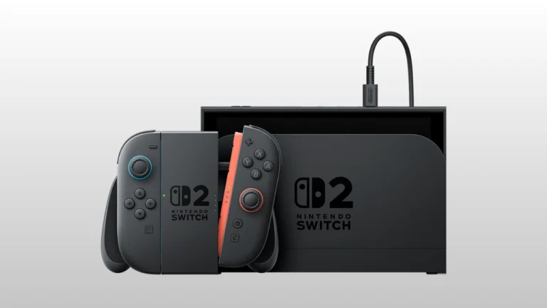 Console Nintendo Switch 2 exibido em fundo branco, mostrando a base preta com o novo logotipo e os controles Joy-Con acoplados ao suporte, com destaque para o controle direito na cor laranja.